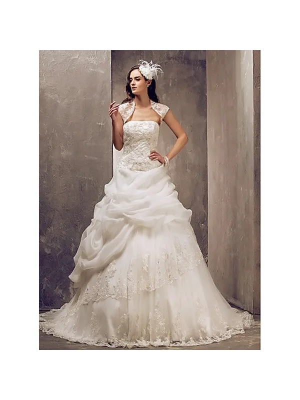 Abito da sposa con gonna a meringa in organza e corpetto in pizzo con bolero