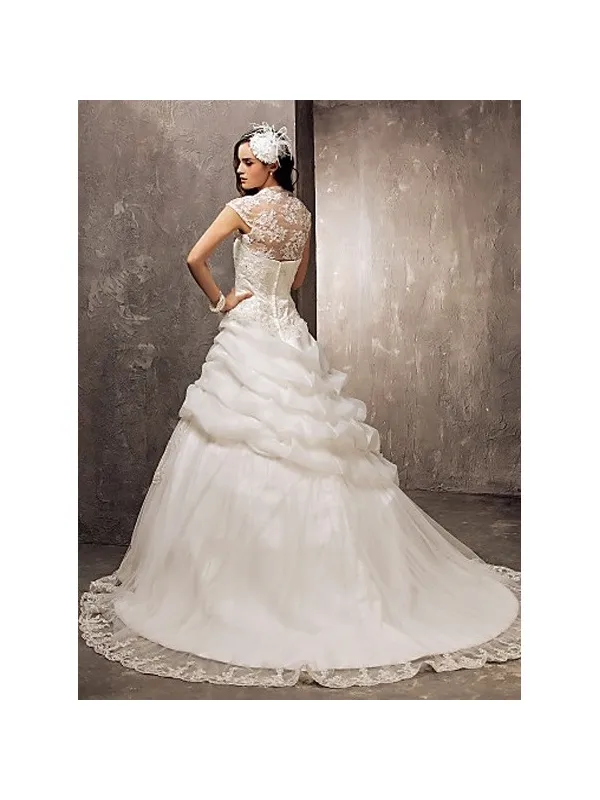 Abito da sposa con gonna a meringa in organza e corpetto in pizzo con bolero