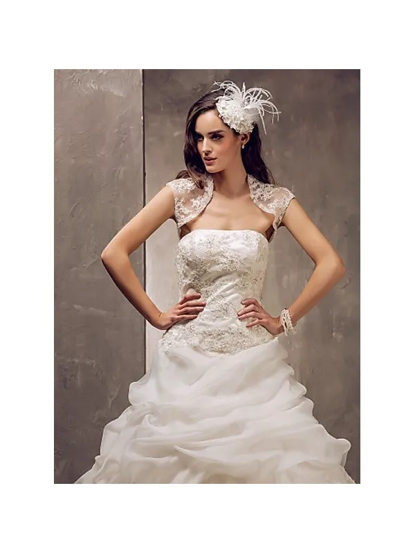 Abito da sposa con gonna a meringa in organza e corpetto in pizzo con bolero