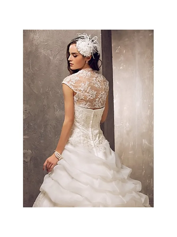 Abito da sposa con gonna a meringa in organza e corpetto in pizzo con bolero